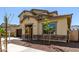 Charming two-story home featuring a well-manicured front yard and elegant exterior stone accents at 20951 E Via Del Sol St, Queen Creek, AZ 85142