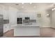 Beautiful kitchen with a large white island, modern appliances, and stylish backsplash at 20951 E Via Del Sol St, Queen Creek, AZ 85142