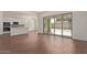 Bright living room showcasing an island kitchen, and a sliding glass door to the backyard at 20951 E Via Del Sol St, Queen Creek, AZ 85142