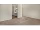 This is a bright, spacious bedroom featuring neutral paint and carpet with a modern bathroom attached at 20951 E Via Del Sol St, Queen Creek, AZ 85142