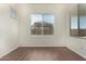 Neutral room featuring tile floors, a bright window with blinds for optimal privacy at 20951 E Via Del Sol St, Queen Creek, AZ 85142