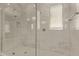 This is a modern walk-in shower featuring gray tile and a seamless glass enclosure at 20951 E Via Del Sol St, Queen Creek, AZ 85142