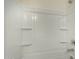 This is a shower tub combo with molded plastic and shelving at 20951 E Via Del Sol St, Queen Creek, AZ 85142
