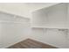 This is a walk-in closet with ample hanging space and neutral carpet at 20951 E Via Del Sol St, Queen Creek, AZ 85142