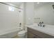 Bathroom with a shower-tub combo and a vanity with matte black fixtures at 2121 W Sonoran Desert Dr # 13, Phoenix, AZ 85085