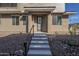 Exterior of a modern home with a landscaped front yard and a concrete entryway at 2121 W Sonoran Desert Dr # 13, Phoenix, AZ 85085