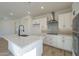 Bright kitchen featuring a large island with a waterfall countertop and stainless steel appliances at 2121 W Sonoran Desert Dr # 13, Phoenix, AZ 85085
