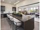 Community kitchen includes modern appliances, a long seating island, and lots of seating at 2121 W Sonoran Desert Dr # 13, Phoenix, AZ 85085