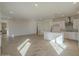 Spacious living room with bright lighting and light tile flooring leading into the kitchen at 2121 W Sonoran Desert Dr # 13, Phoenix, AZ 85085