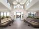 Lobby area with soaring ceilings, lounge seating and large windows overlooking the pool at 2121 W Sonoran Desert Dr # 13, Phoenix, AZ 85085