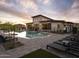Community pool boasts a modern design with lounge seating and views of the clubhouse at 2121 W Sonoran Desert Dr # 13, Phoenix, AZ 85085