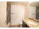This bathroom has granite countertops, a vanity, and a shower-tub combination with a curtain at 21320 N 56Th St # 1085, Phoenix, AZ 85054