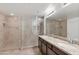 Elegant bathroom with a large shower, dual sinks, granite counters, and tile flooring at 21320 N 56Th St # 1085, Phoenix, AZ 85054