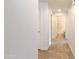 Hallway view featuring ceramic tile flooring and doors leading to various rooms in the home at 21320 N 56Th St # 1085, Phoenix, AZ 85054