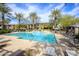 Community pool featuring lounge chairs, shaded tables, and desert landscaping at 21320 N 56Th St # 1085, Phoenix, AZ 85054