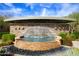 Community water feature with stone accents, waterfall, and lush landscaping at 21320 N 56Th St # 1085, Phoenix, AZ 85054