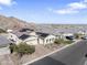 Beautiful home with solar panels and desert landscaping is nestled in a vibrant neighborhood at 21432 W Minnezona Ave, Buckeye, AZ 85396