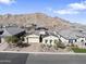 Beautiful home with solar panels and desert landscaping is nestled in a vibrant neighborhood at 21432 W Minnezona Ave, Buckeye, AZ 85396