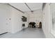 Well-lit two car garage with TV and organization system at 21432 W Minnezona Ave, Buckeye, AZ 85396