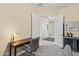 Home office with neutral walls, carpet, and a desk for a quiet workspace at 21432 W Minnezona Ave, Buckeye, AZ 85396