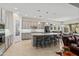 Well-equipped kitchen with an island, pendant lighting, and stainless steel appliances at 21432 W Minnezona Ave, Buckeye, AZ 85396