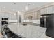 Beautiful kitchen with a large island, stainless steel appliances, modern cabinets, and recessed lighting at 21432 W Minnezona Ave, Buckeye, AZ 85396