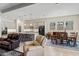 Open floorplan view of the kitchen, dining, and living areas with neutral décor and natural light at 21432 W Minnezona Ave, Buckeye, AZ 85396