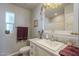Well-lit bathroom featuring a vanity with a sink, a decorative mirror, and a shower with curtain at 2206 S Ellsworth Rd # 50B, Mesa, AZ 85209