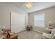 Serene bedroom with wood-look floors, a closet with sliding doors, and comfortable decor at 2206 S Ellsworth Rd # 50B, Mesa, AZ 85209