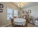 Charming dining room with round table, natural light, and a warm, inviting atmosphere at 2206 S Ellsworth Rd # 50B, Mesa, AZ 85209
