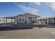 Attractive home featuring a covered carport, welcoming front porch, and well-kept yard, nestled in a serene neighborhood at 2206 S Ellsworth Rd # 50B, Mesa, AZ 85209