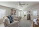 Inviting living room with natural light, fan, and comfortable seating area at 2206 S Ellsworth Rd # 50B, Mesa, AZ 85209
