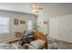 Bright main bedroom with a bedframe, ensuite bathroom, and natural light at 2206 S Ellsworth Rd # 50B, Mesa, AZ 85209