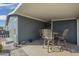 Covered patio with outdoor seating, perfect for relaxing and entertaining at 2206 S Ellsworth Rd # 50B, Mesa, AZ 85209