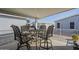 Covered patio view with a table and chairs, perfect for outdoor dining and entertaining at 2206 S Ellsworth Rd # 50B, Mesa, AZ 85209
