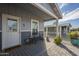 Inviting covered porch with stylish decor, seating, and a welcoming entrance, perfect for relaxing outdoors at 2206 S Ellsworth Rd # 50B, Mesa, AZ 85209
