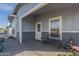 Charming covered porch featuring a cozy bench, decorative elements, and a welcoming entryway, ideal for relaxation at 2206 S Ellsworth Rd # 50B, Mesa, AZ 85209