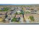 Expansive aerial view of a vibrant neighborhood featuring well-maintained homes, desert landscape, and mountain views at 22722 N 120Th Ln, Sun City, AZ 85373