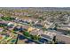 A high-angle perspective of the suburban development displaying manicured lawns and backyard pools in a desert setting at 22722 N 120Th Ln, Sun City, AZ 85373