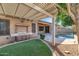 Backyard featuring an outdoor kitchen, patio, and a swimming pool at 22722 N 120Th Ln, Sun City, AZ 85373