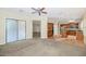 Open-concept living space combines living and kitchen area with a modern layout and neutral color palette at 22722 N 120Th Ln, Sun City, AZ 85373