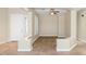 Inviting living room features a neutral color palette, tile entryway, and plush carpeting at 22722 N 120Th Ln, Sun City, AZ 85373