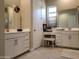 Bright bathroom featuring dual sinks, white cabinetry, a vanity, and tiled floors at 2541 E San Ricardo Trl, Casa Grande, AZ 85194