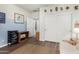 Comfortable bedroom with sliding closet doors, decor wall, and wood-look flooring at 26485 W Yukon Dr, Buckeye, AZ 85396