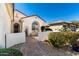 Front exterior showing a patio with seating, desert plants, and a private entrance at 26485 W Yukon Dr, Buckeye, AZ 85396