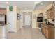 Open foyer featuring tile floors, fireplace, and convenient bar area at 26485 W Yukon Dr, Buckeye, AZ 85396