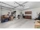 Spacious garage featuring ample storage space and a convenient utility sink for various projects at 26485 W Yukon Dr, Buckeye, AZ 85396