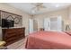 Tranquil bedroom with a ceiling fan, ensuite bathroom, and ample closet space at 26485 W Yukon Dr, Buckeye, AZ 85396