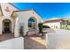 Charming patio with brick pavers, outdoor seating, and lovely desert landscaping at 26485 W Yukon Dr, Buckeye, AZ 85396