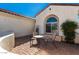 Charming courtyard patio with patterned brick flooring and stucco walls, perfect for outdoor relaxing at 26485 W Yukon Dr, Buckeye, AZ 85396